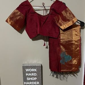 Dark burgundy color saree with blouse.